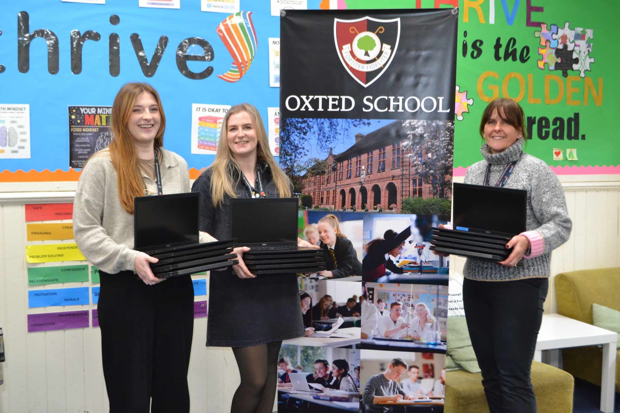 Level Up Laptop Appeal donating laptops to staff at Oxted School